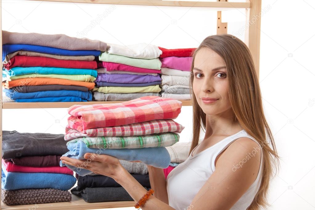 depositphotos 45852675 stock photo young woman holding a pile